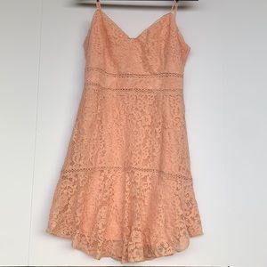 Adorable pink lace dress. Wear this to drink mimosas at your fav brunch spot!